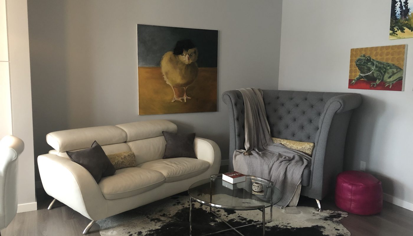 Modern living room set with custom grey upholstery.