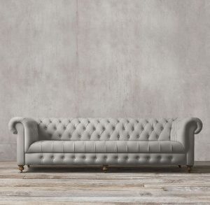 Timeless chesterfield sofa in soft neutral fabric.